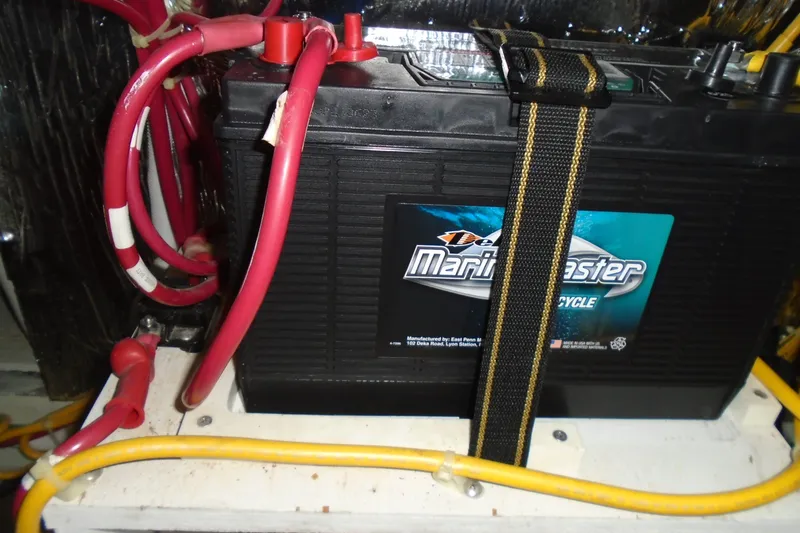 Slide: The Image of Battery setup in a 2004 Carver 356 Motor Yacht with red and yellow cables. - 55