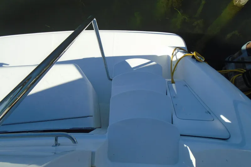 Slide: The Image of 2004 Carver 356 Motor Yacht deck with steps and railing, docked by water. - 58