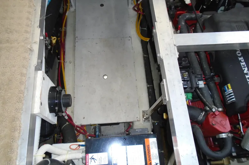 Slide: The Image of Engine compartment of 2004 Carver 356 Motor Yacht, showcasing mechanical components and wiring. - 63