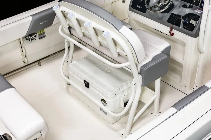 Slide: The Image of Manufacturer Provided Image: 2021 Robalo R242 Center Console boat interior with seating and cooler. - 16