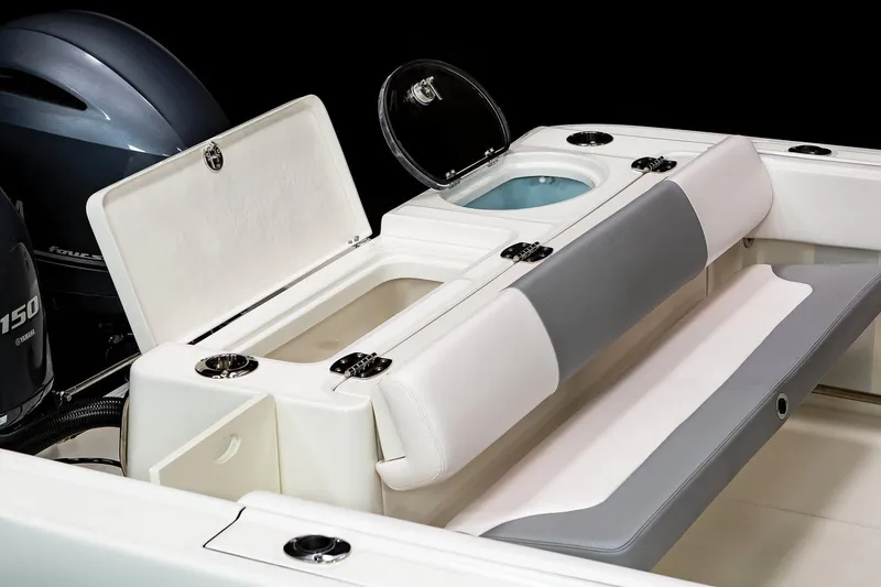 Slide: The Image of Manufacturer Provided Image: 2021 Robalo R242 Center Console boat with open storage compartments. - 17