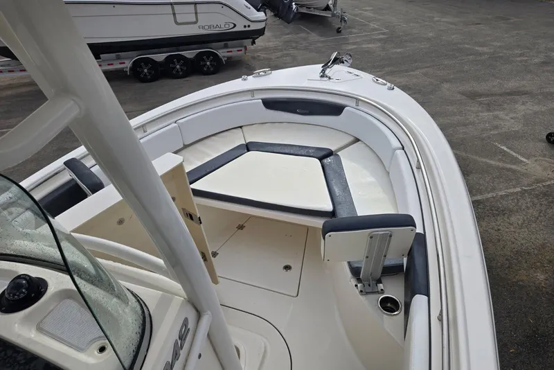 Slide: The Image of 2021 Robalo R242 Center Console boat with spacious seating and sleek design. - 25