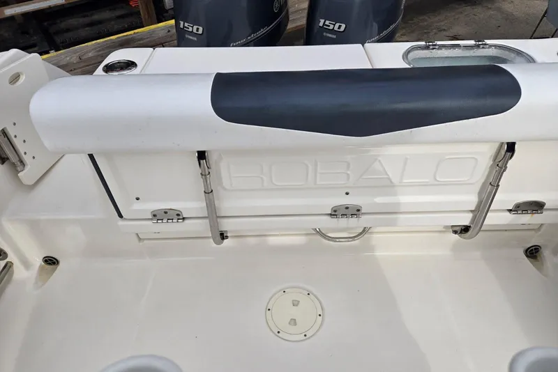 Slide: The Image of 2021 Robalo R242 Center Console boat interior with Yamaha 150 engines. - 26