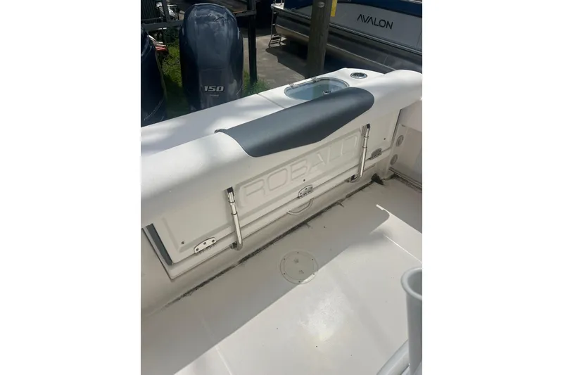 Slide: The Image of 2021 Robalo R242 Center Console boat interior with Yamaha 150 engine. - 30