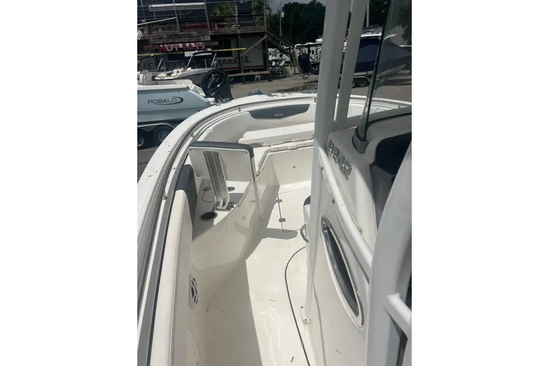 Slide: The Image of 2021 Robalo R242 Center Console boat interior, showcasing seating and console details. - 31