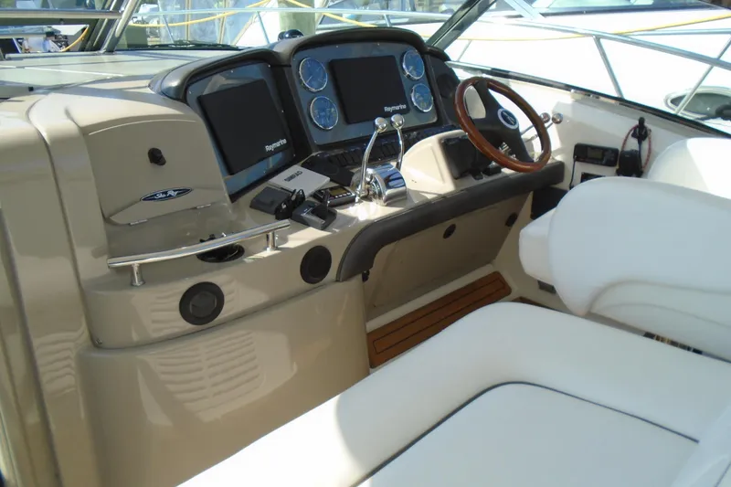 Slide: The Image of 2007 Sea Ray 40 Sundancer helm with dual screens and leather steering wheel. - 12