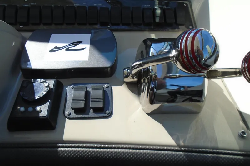 Slide: The Image of Control panel of 2007 Sea Ray 40 Sundancer boat with throttle and switches. - 15