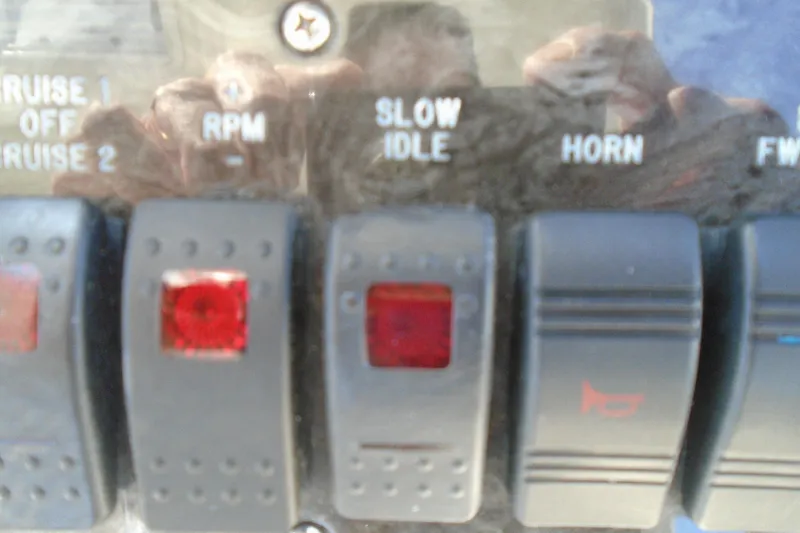 Slide: The Image of Control panel of a 2007 Sea Ray 40 Sundancer boat with labeled switches. - 16