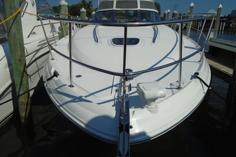 Slide: The Image of 2007 Sea Ray 40 Sundancer yacht docked at marina, front view. - 2