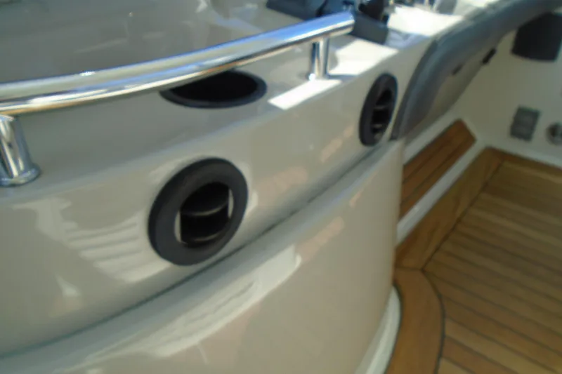 Slide: The Image of 2007 Sea Ray 40 Sundancer boat deck with wooden flooring and metal railings. - 20