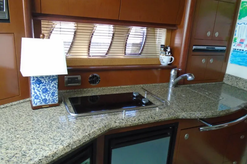 Slide: The Image of Luxurious 2007 Sea Ray 40 Sundancer yacht kitchen with granite countertops and modern appliances. - 22