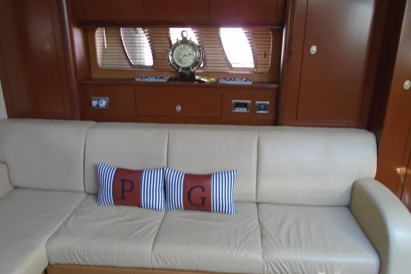 Slide: The Image of Luxurious interior of 2007 Sea Ray 40 Sundancer with beige sofa and decorative pillows. - 23