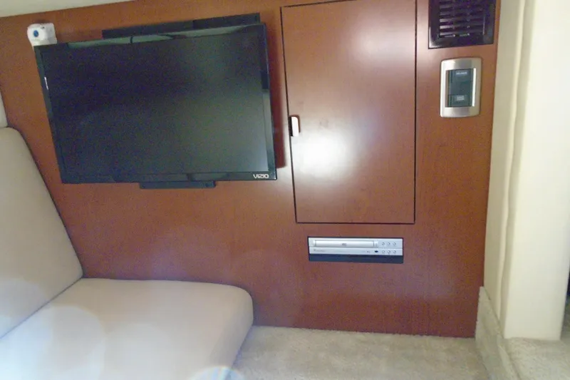 Slide: The Image of Interior of 2007 Sea Ray 40 Sundancer with TV and control panel. - 28