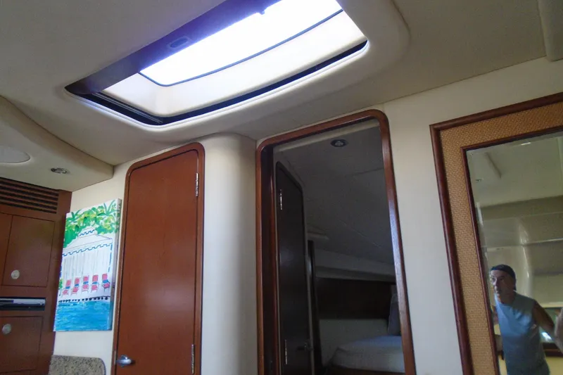 Slide: The Image of Interior of 2007 Sea Ray 40 Sundancer yacht with skylight and wooden doors. - 30