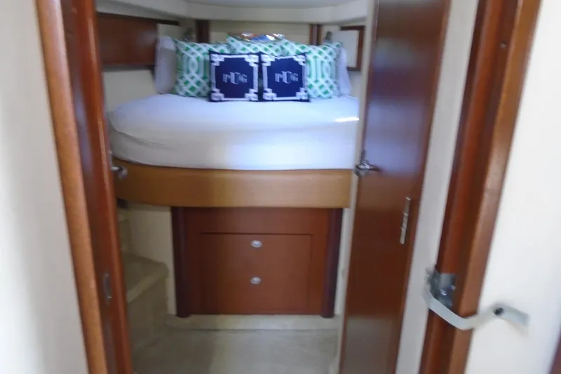 Slide: The Image of Cozy cabin interior of 2007 Sea Ray 40 Sundancer yacht with plush bedding. - 32