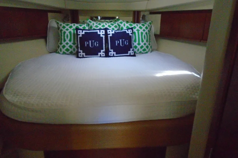 Slide: The Image of Luxurious cabin interior of 2007 Sea Ray 40 Sundancer with decorative pillows. - 34