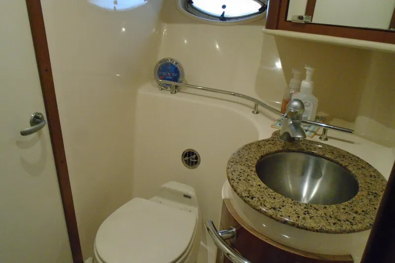 Slide: The Image of Bathroom interior of 2007 Sea Ray 40 Sundancer yacht with granite sink and toilet. - 35
