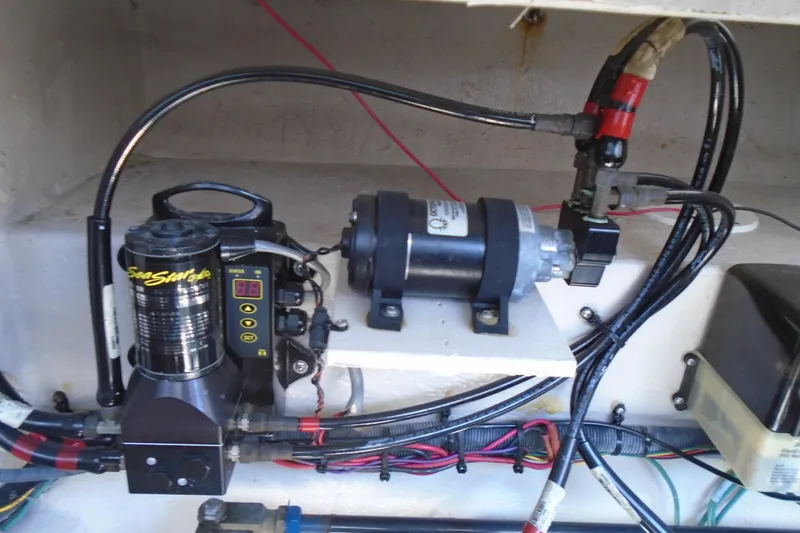 Slide: The Image of Engine compartment of 2007 Sea Ray 40 Sundancer with hydraulic and electrical components. - 47