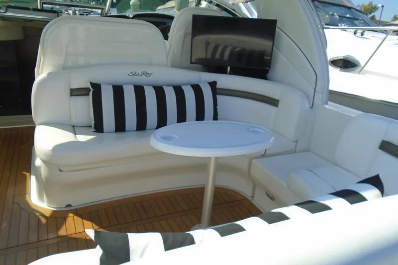 Slide: The Image of Luxurious 2007 Sea Ray 40 Sundancer yacht interior with white seating and striped cushions. - 9