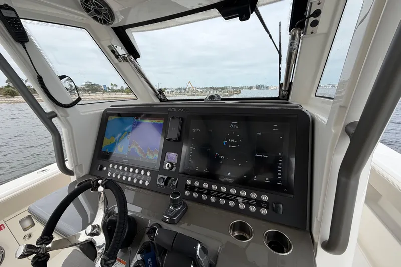 Slide: The Image of Helm of 2026 Solace 37 CS boat with advanced navigation displays. - 16