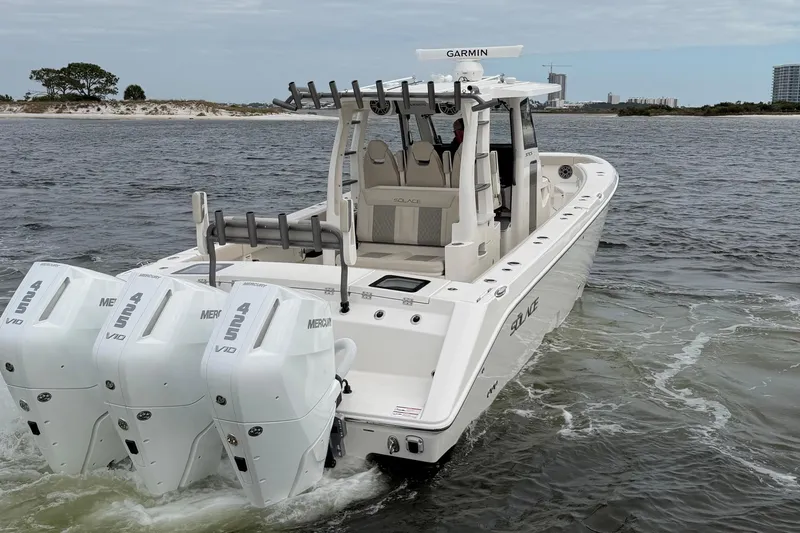 Slide: The Image of 2026 Solace 37 CS boat with triple Mercury 425 V10 engines on water. - 9