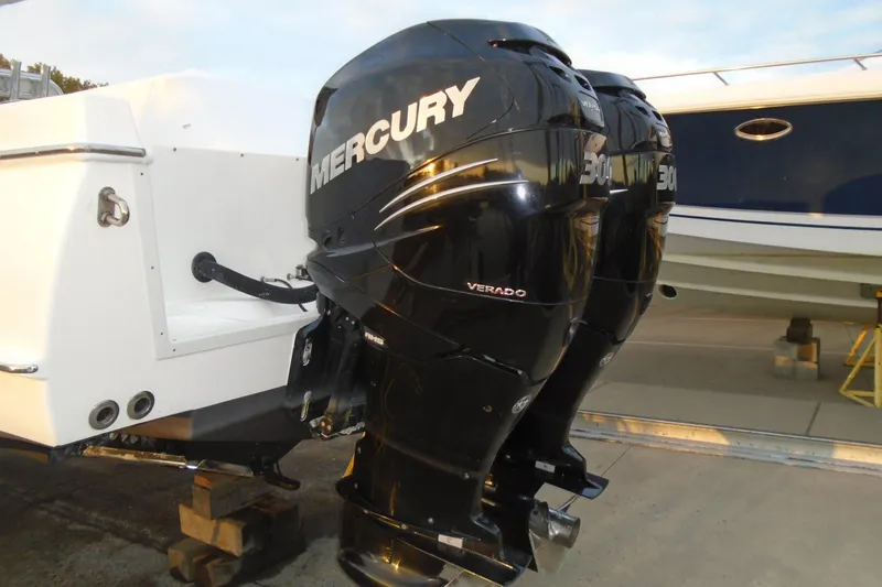 Slide: The Image of Twin Mercury Verado engines on a 2006 Buddy Davis 34 Center Console boat. - 16