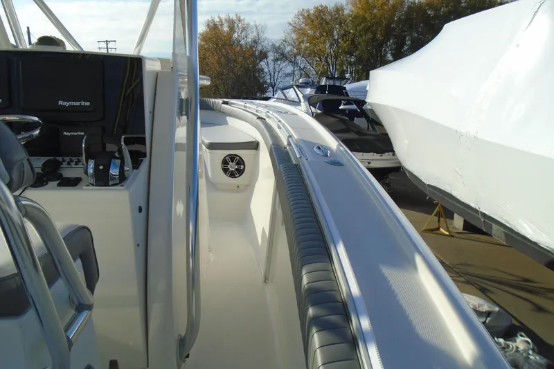 Slide: The Image of 2006 Buddy Davis 34 Center Console boat with Raymarine electronics, docked outdoors. - 23