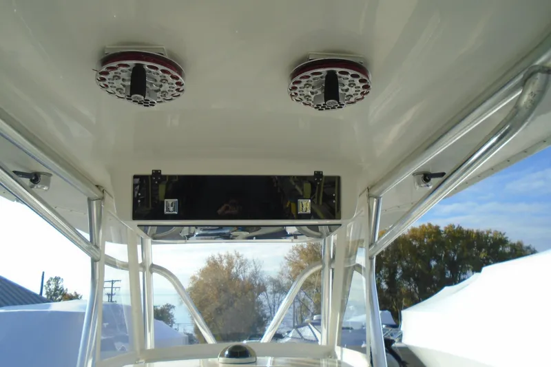 Slide: The Image of 2006 Buddy Davis 34 Center Console boat interior with speakers and control panel. - 25