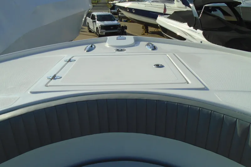 Slide: The Image of 2006 Buddy Davis 34 Center Console boat deck with seating and storage compartment. - 33