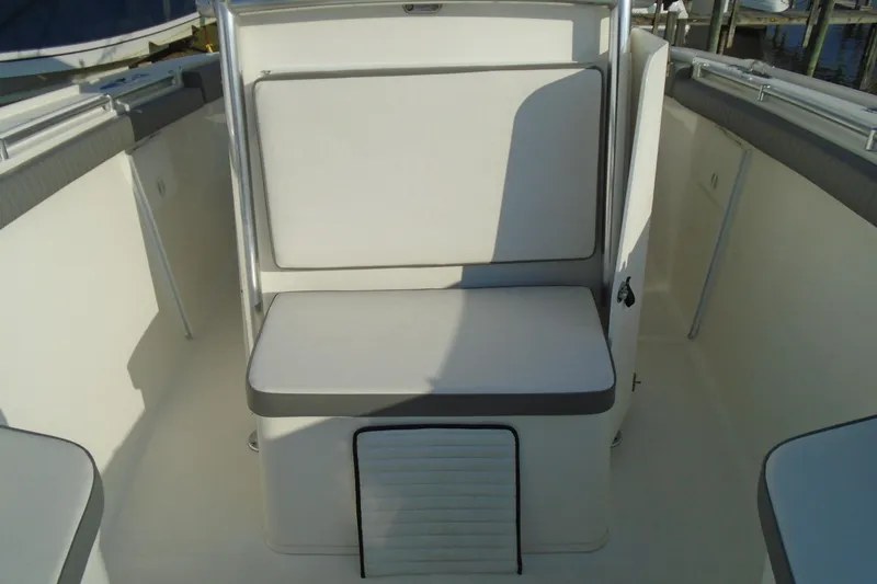 Slide: The Image of 2006 Buddy Davis 34 Center Console boat seating area, featuring cushioned bench. - 34