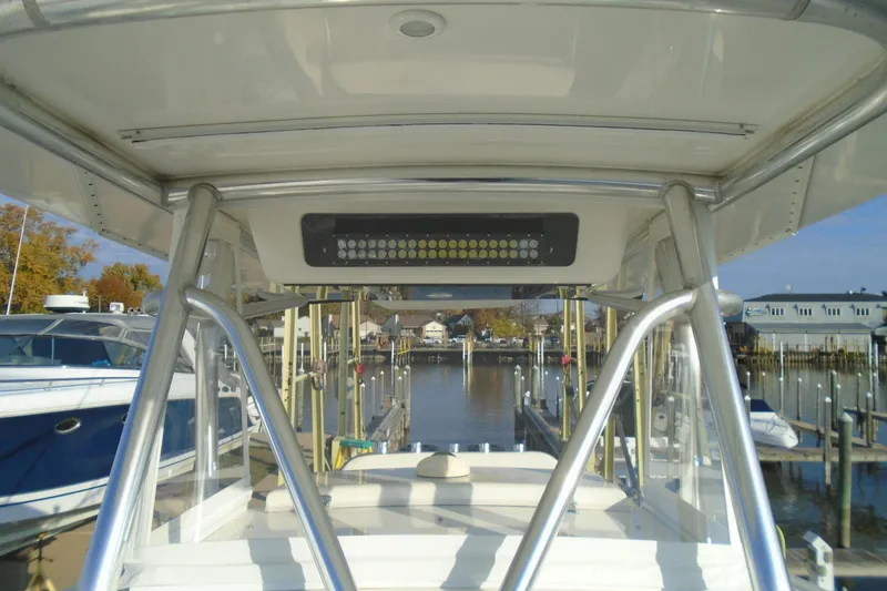 Slide: The Image of 2006 Buddy Davis 34 Center Console boat docked at marina, view from helm. - 35