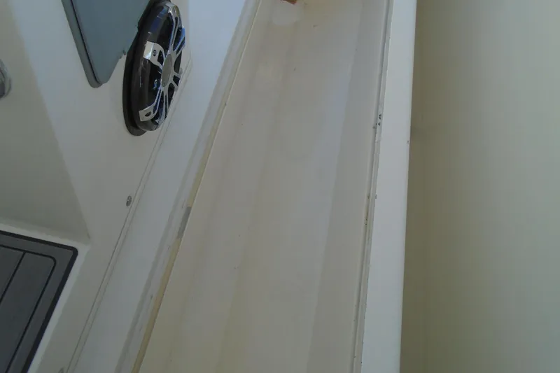 Slide: The Image of 2006 Buddy Davis 34 Center Console boat interior with speaker detail. - 44
