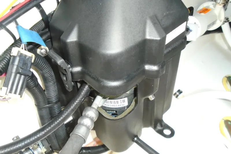 Slide: The Image of Engine compartment of 2006 Buddy Davis 34 Center Console boat, showing wiring and components. - 49