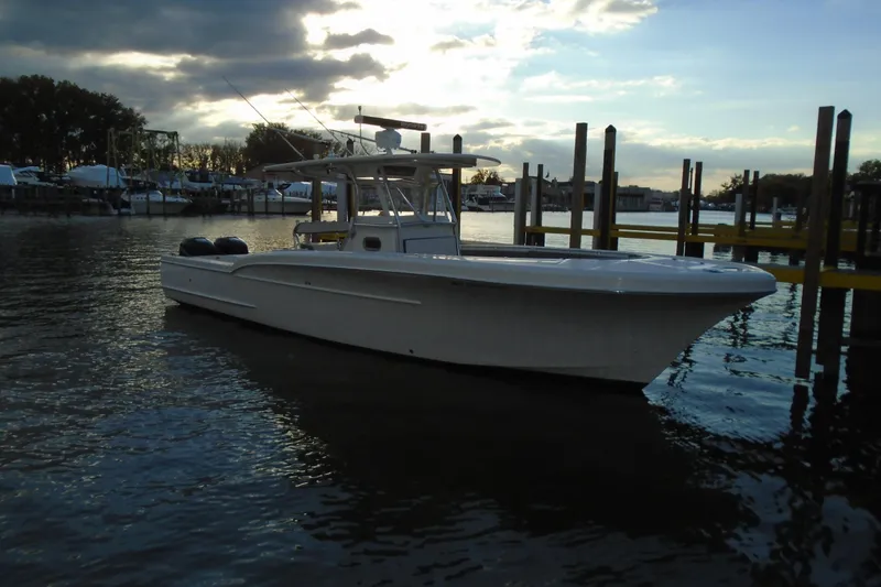 Slide: The Image of 2006 Buddy Davis 34 Center Console boat docked at sunset. - 5