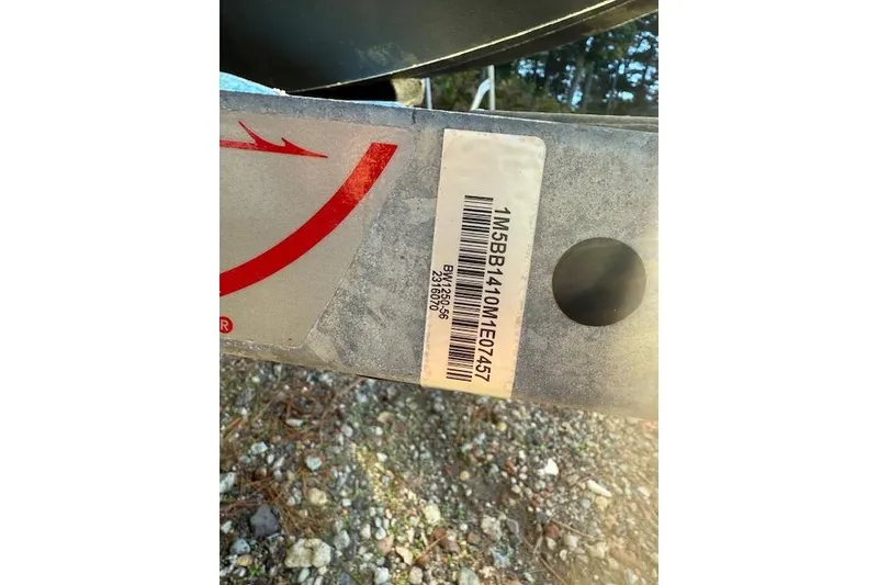 Slide: The Image of 2021 Boston Whaler 130 Super Sport trailer with barcode and serial number. - 16