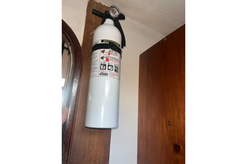 Slide: The Image of Fire extinguisher mounted on a Beneteau First 38.5 sailboat, 1984 model. - 16