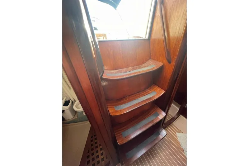 Slide: The Image of Wooden interior stairs of a 1984 Beneteau First 38.5 sailboat. - 6