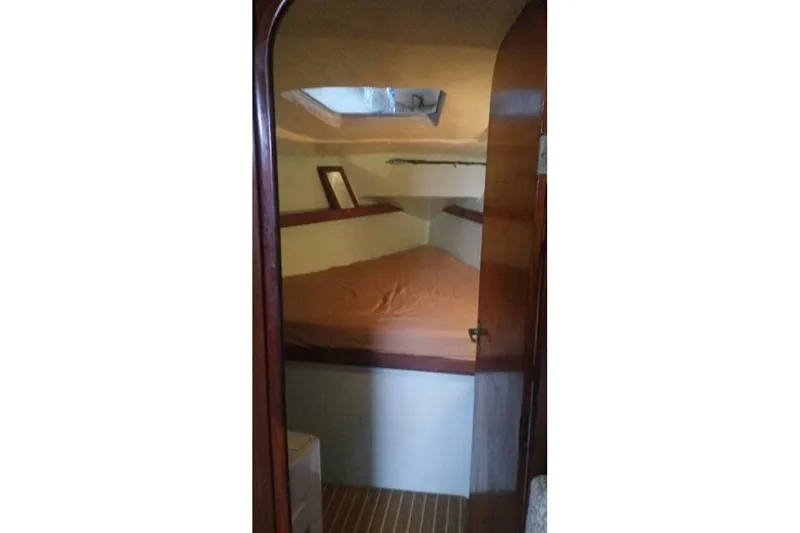 Slide: The Image of Cabin interior of 1984 Beneteau First 38.5 sailboat with cozy sleeping area. - 9