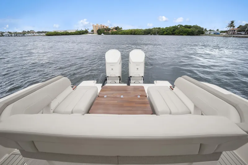 Slide: The Image of 2022 Tiara Sport 43 LS with luxurious seating and water view. - 24
