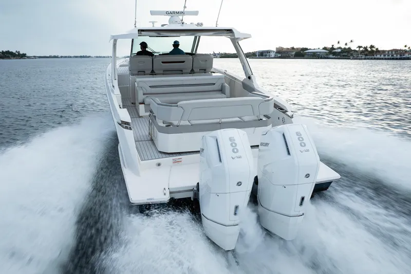 Slide: The Image of 2022 Tiara Sport 43 LS boat cruising with dual Mercury 600 V12 engines. - 9