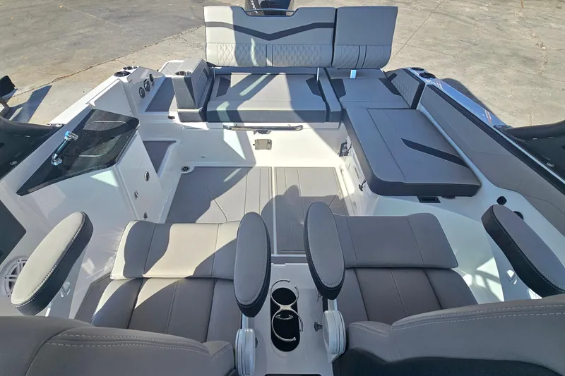 Slide: The Image of Interior of 2026 Monterey Elite 27 OB boat with luxurious seating and modern design. - 13
