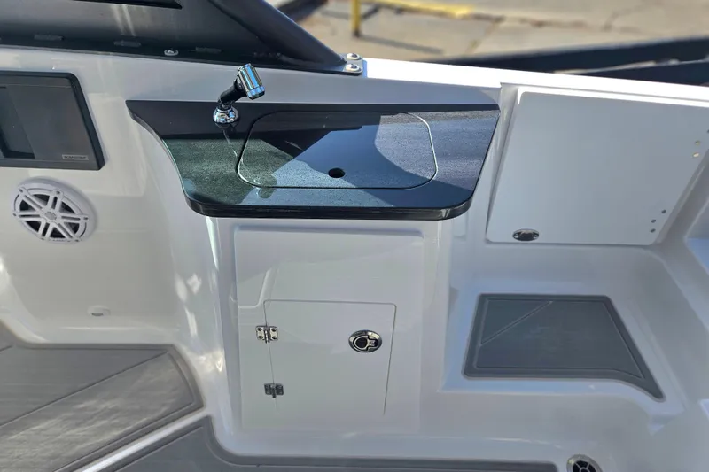 Slide: The Image of 2026 Monterey Elite 27 OB boat interior with sink and storage cabinet. - 15