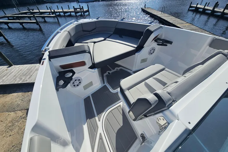Slide: The Image of 2026 Monterey Elite 27 OB boat interior with sleek seating and waterfront view. - 23