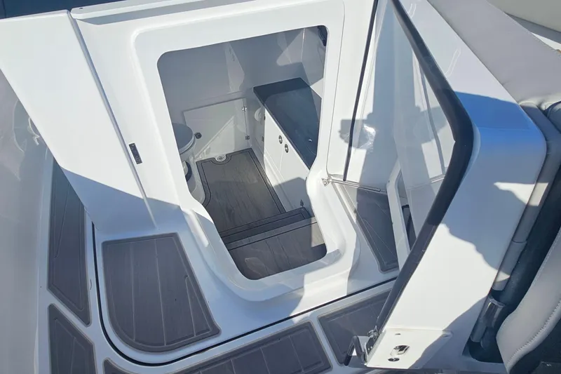 Slide: The Image of Interior view of 2026 Monterey Elite 27 OB boat cabin with modern design. - 26