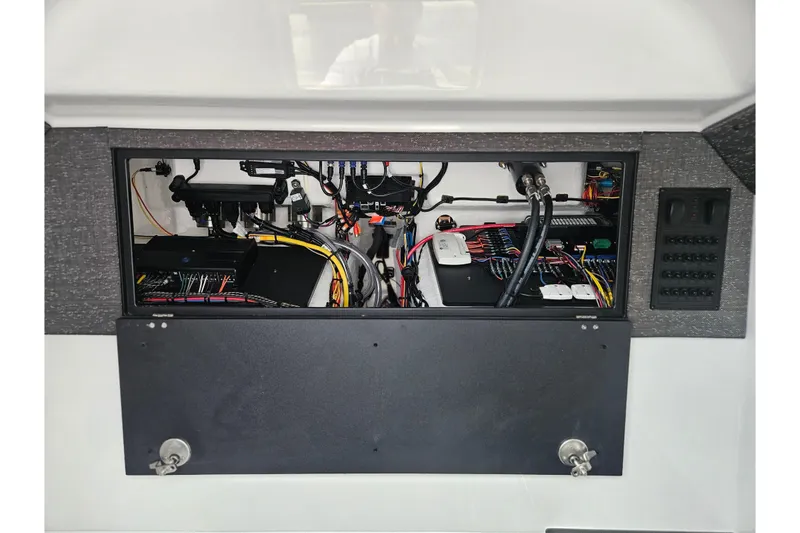 Slide: The Image of Electrical panel of 2026 Monterey Elite 27 OB boat, showcasing wiring and components. - 28