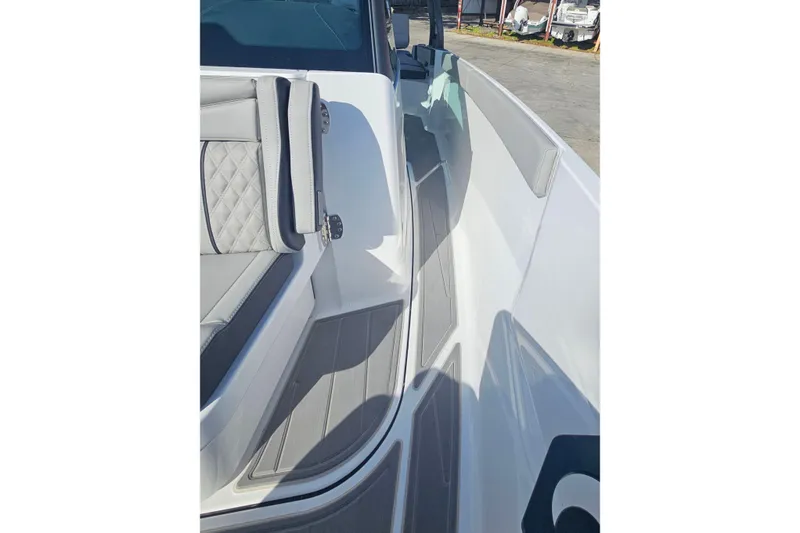 Slide: The Image of 2026 Monterey Elite 27 OB boat interior with sleek seating and modern design. - 30