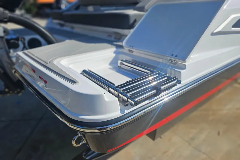 Slide: The Image of 2026 Monterey Elite 27 OB boat with sleek swim platform and stainless steel ladder. - 6