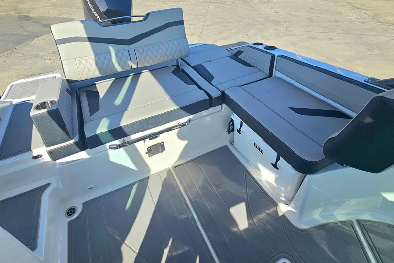 Slide: The Image of 2026 Monterey Elite 27 OB boat interior with sleek seating and modern design. - 9