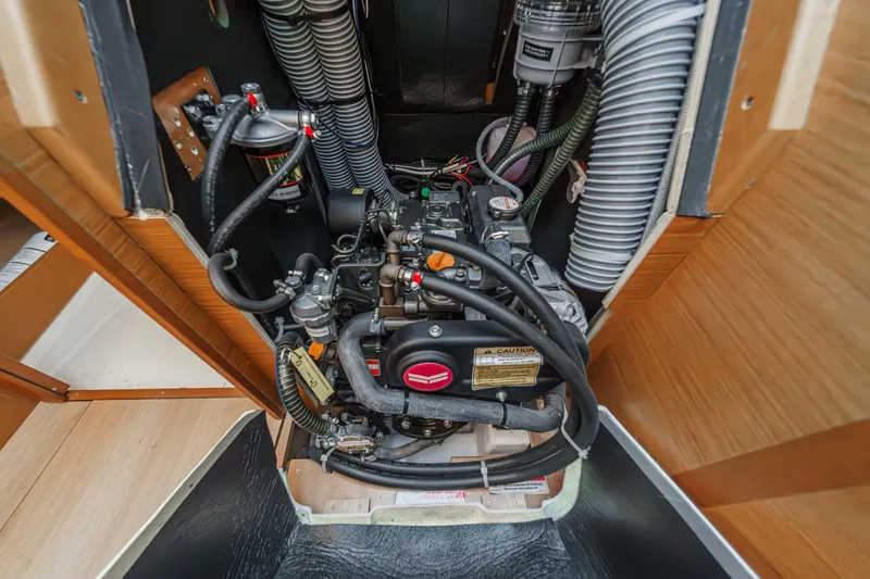 Slide: The Image of Engine compartment of 2022 Jeanneau Sun Odyssey 349 sailboat, showcasing detailed mechanical components. - 21