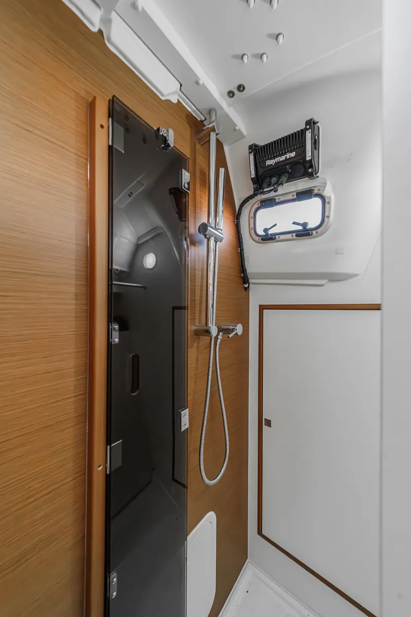Slide: The Image of Modern bathroom interior of 2022 Jeanneau Sun Odyssey 349 yacht, featuring sleek design and shower. - 24